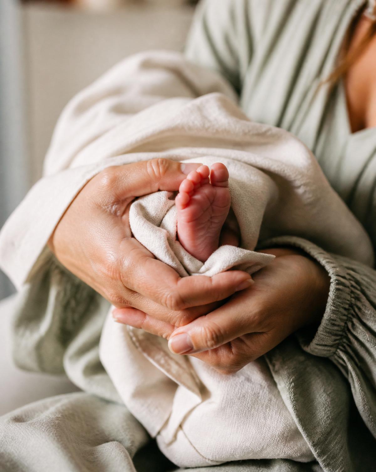 Midwife holding a newborn